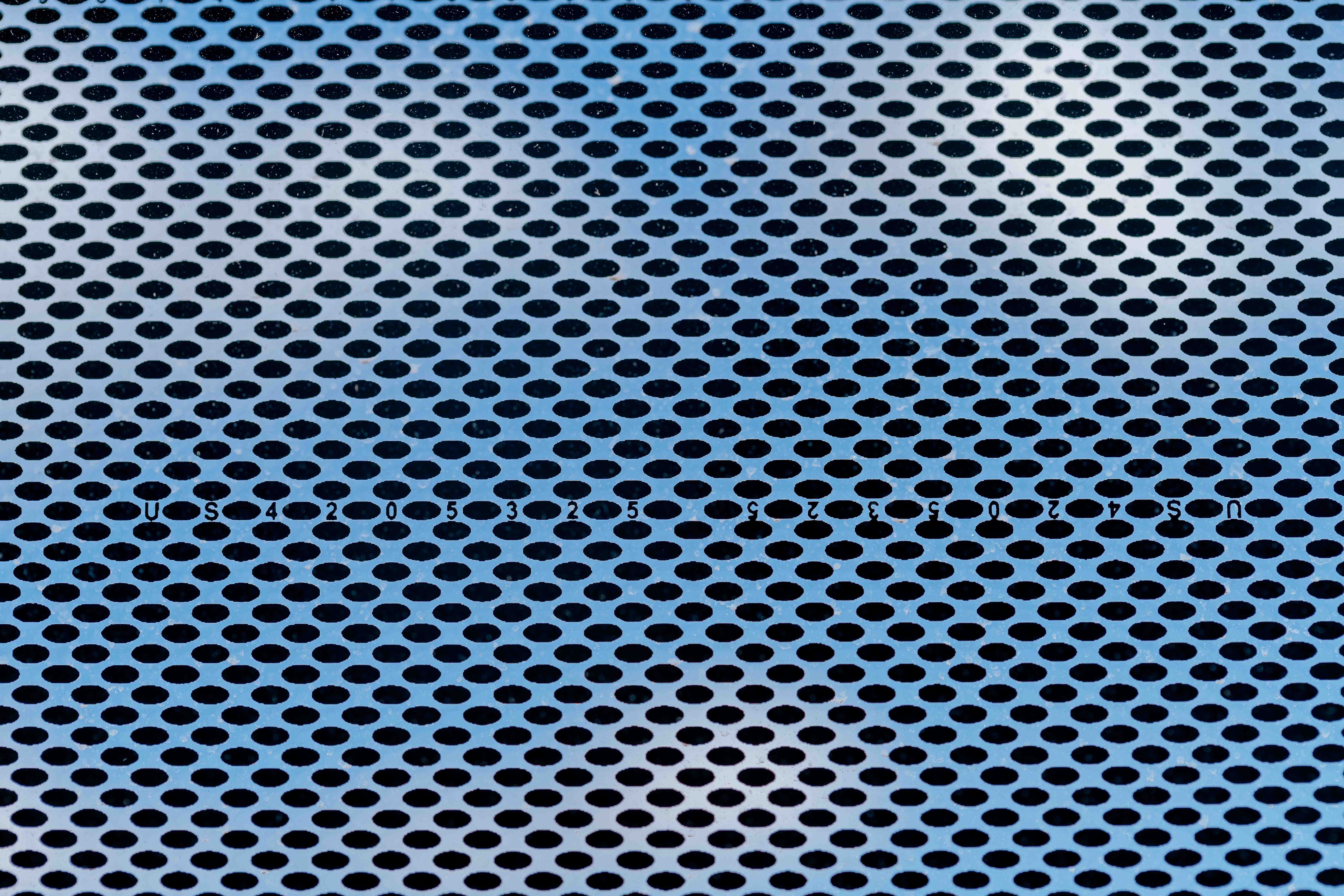 Glass banding on the exterior windows includes the patent numbers of historic innovations in company history.   